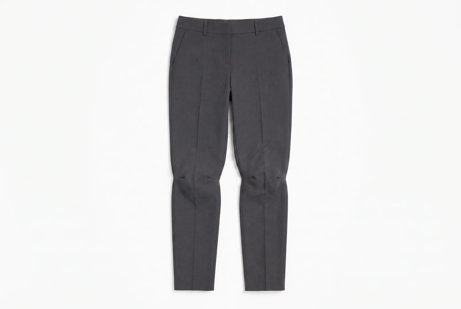 The same trousers laid flat after 9 hours of wear, the knee, seat and waist zones drawn against their morning outlines.