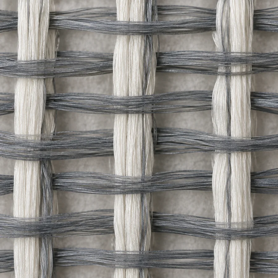 Macro photograph of a fabric with elastic filaments running in one direction only.