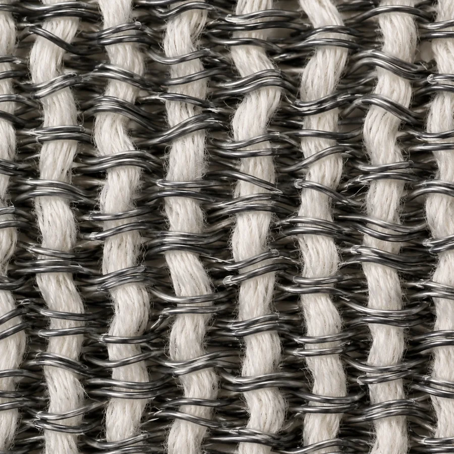 Macro photograph of a fabric with elastic filaments running in both directions.